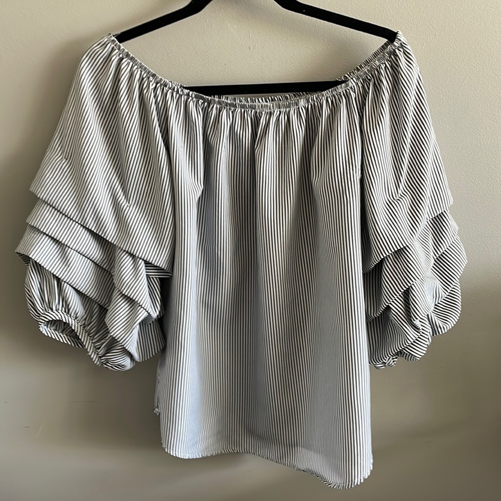 Woman’s navy and white blouse